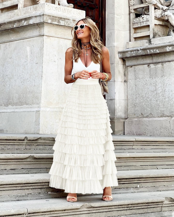 Formal women's evening maxi skirt featuring graceful tiers & ruffles, offering an elegant, sophisticated look.