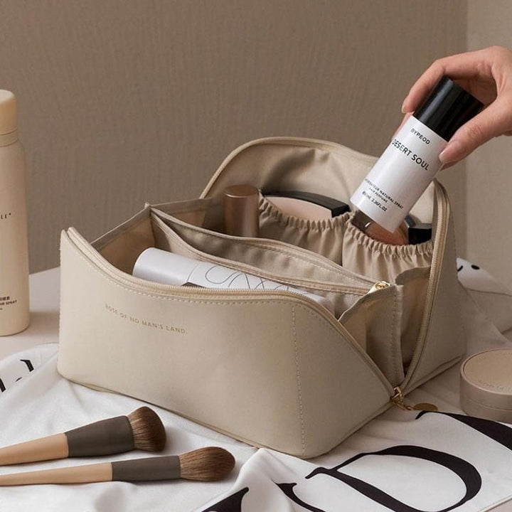 Elegant women's travel makeup organizer bag in pink, perfect for cosmetics & beauty storage.