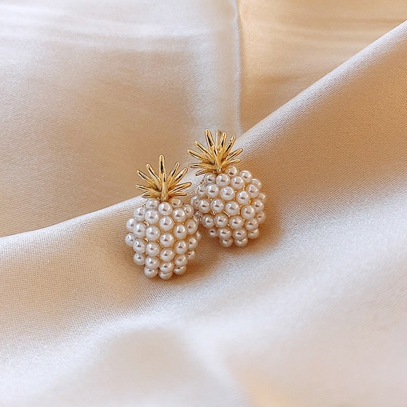 Charming women's pineapple and pearl drop earrings, showcasing a tropical style, ideal for summer outfits.