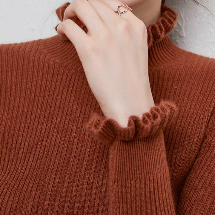 Women's cozy elegant turtleneck jumper. Warm long-sleeve knit sweater, ideal for stylish winter outfits.