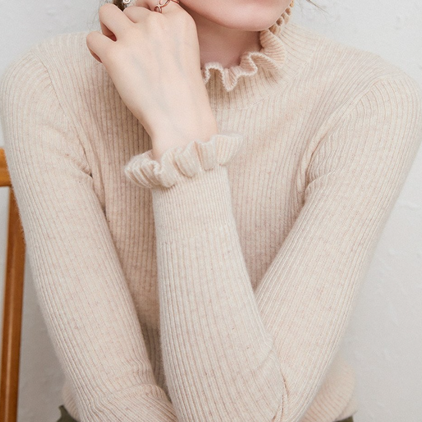 Comfortable women's elegant turtleneck sweater. Warm, chic roll-neck jumper for cozy winter days.