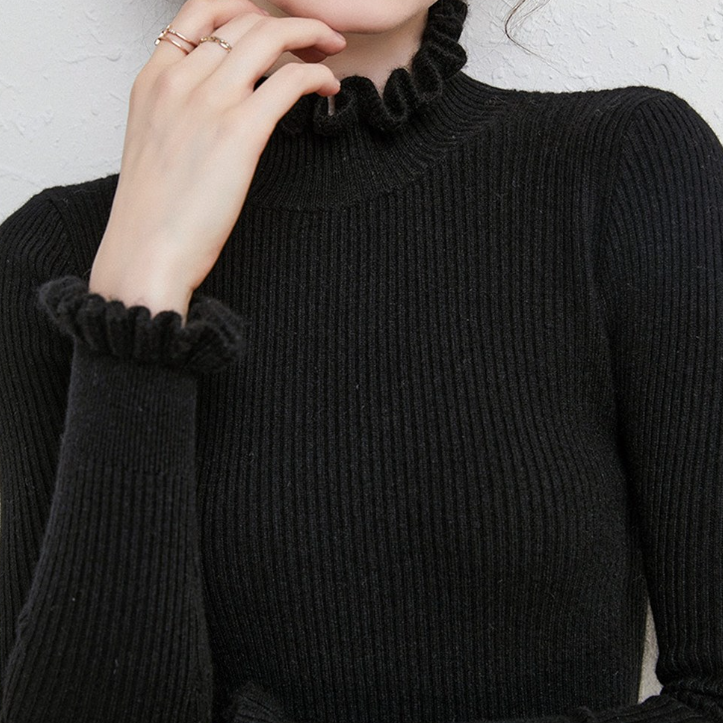 Chic women's roll neck sweater. Warm, luxurious, and comfortable turtleneck jumper for winter style.
