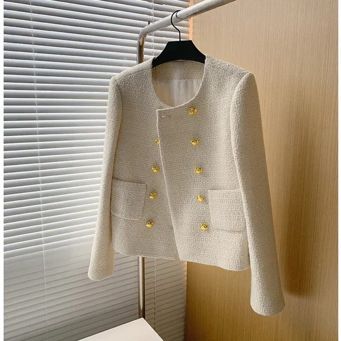 Versatile women's textured blazer jacket. Chic, tailored design for elegant formal wear or smart casual looks.