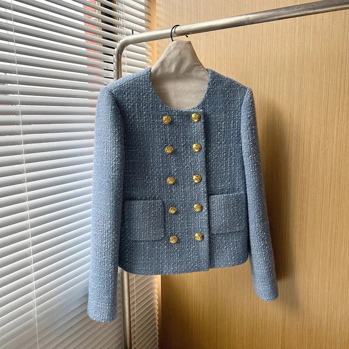 Modern women's elegant tweed blazer. Textured jacket offering a sophisticated, tailored look for any occasion.