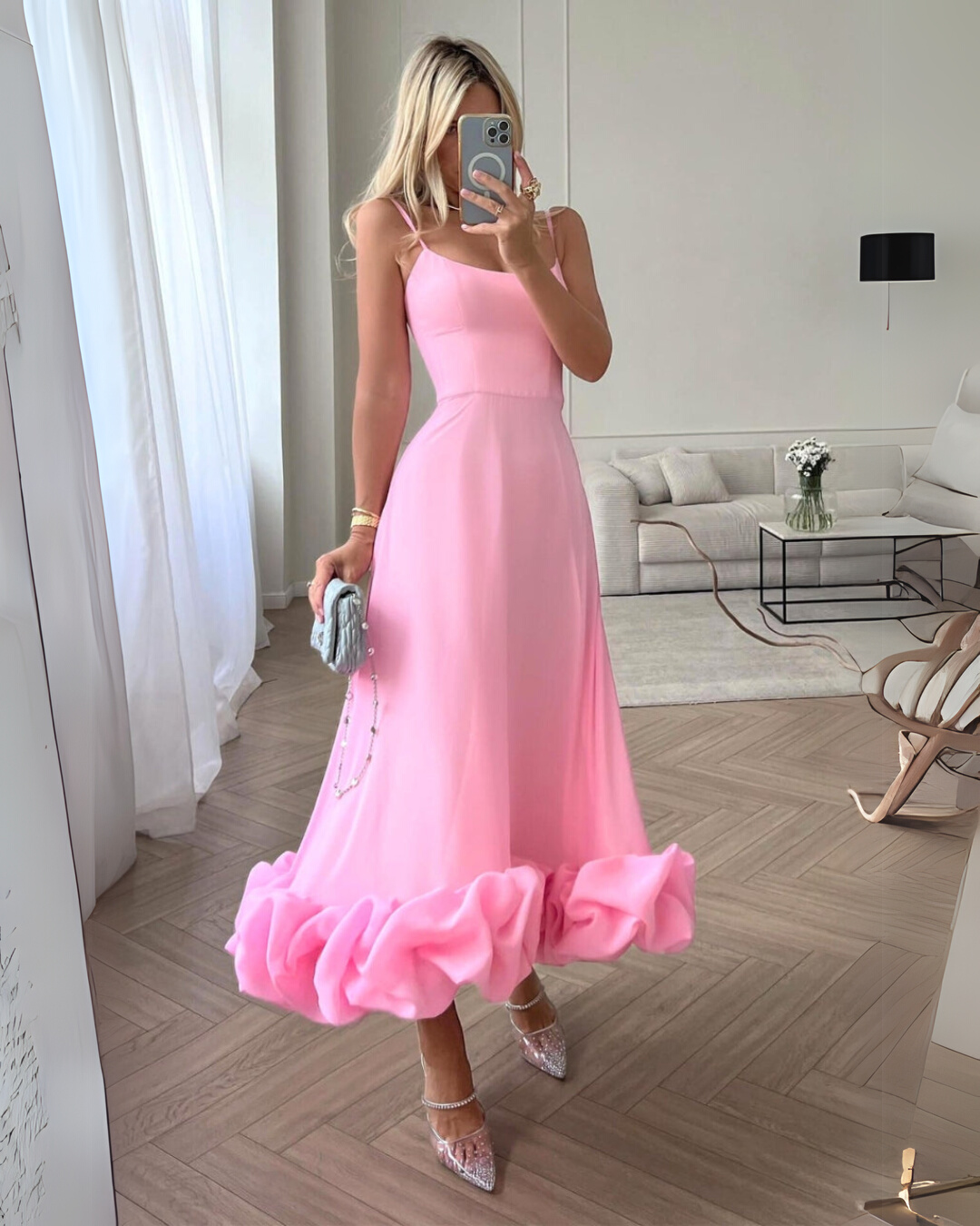Elegant women's twirl dress, flowing fabric, perfect for a chic party or wedding guest outfit.