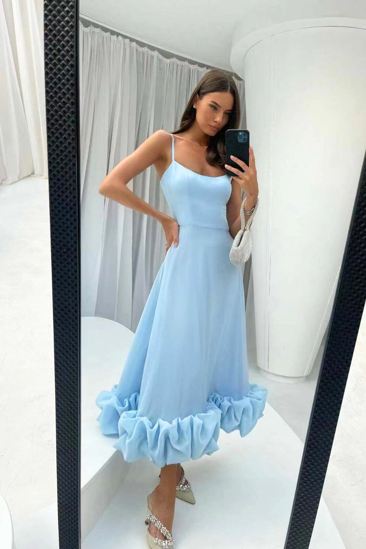 Graceful women's flowing dress, elegant twirl style, ideal for a chic party or wedding celebration.