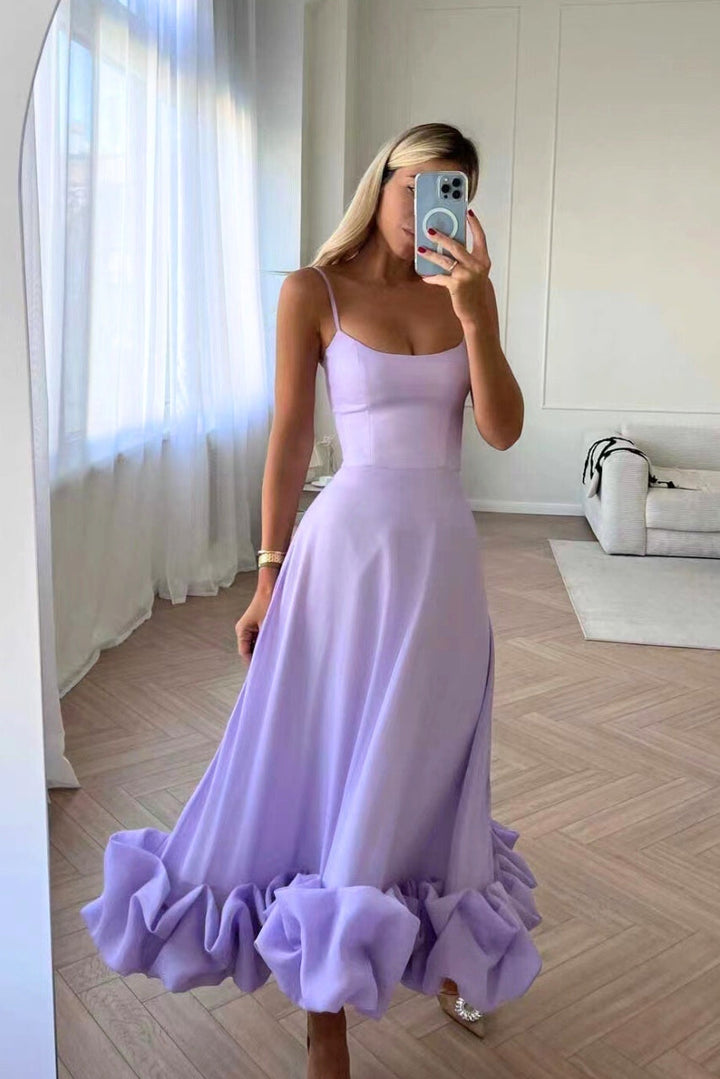 Elegant women's party dress, flowing twirl style, perfect for a sophisticated wedding guest look.