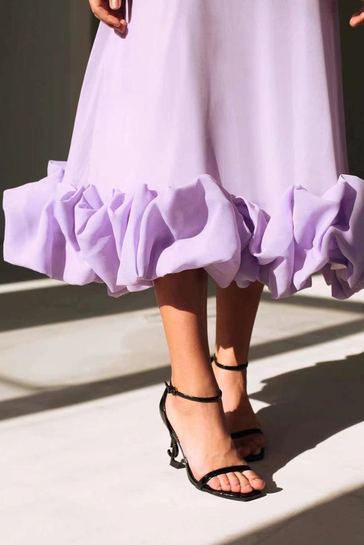 Sophisticated women's elegant twirl dress, flowing design, perfect for a chic wedding guest ensemble.