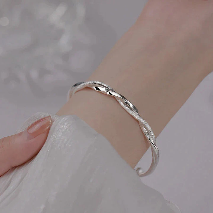 Elegant women's twisted sterling silver bracelet, perfect wrist jewelry for classic style & everyday wear.