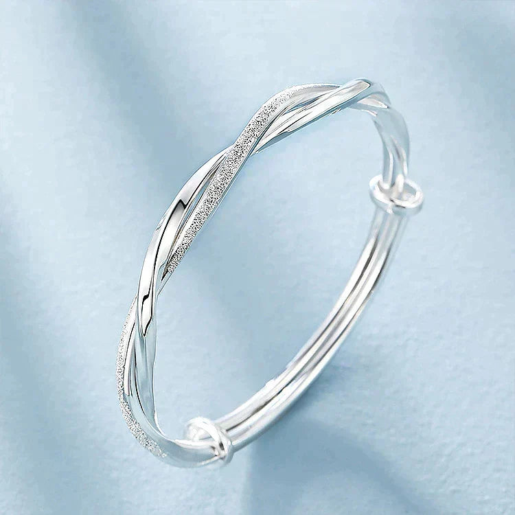 Classic elegant twisted silver bracelet for women, ideal sterling silver jewelry for any fashion occasion.