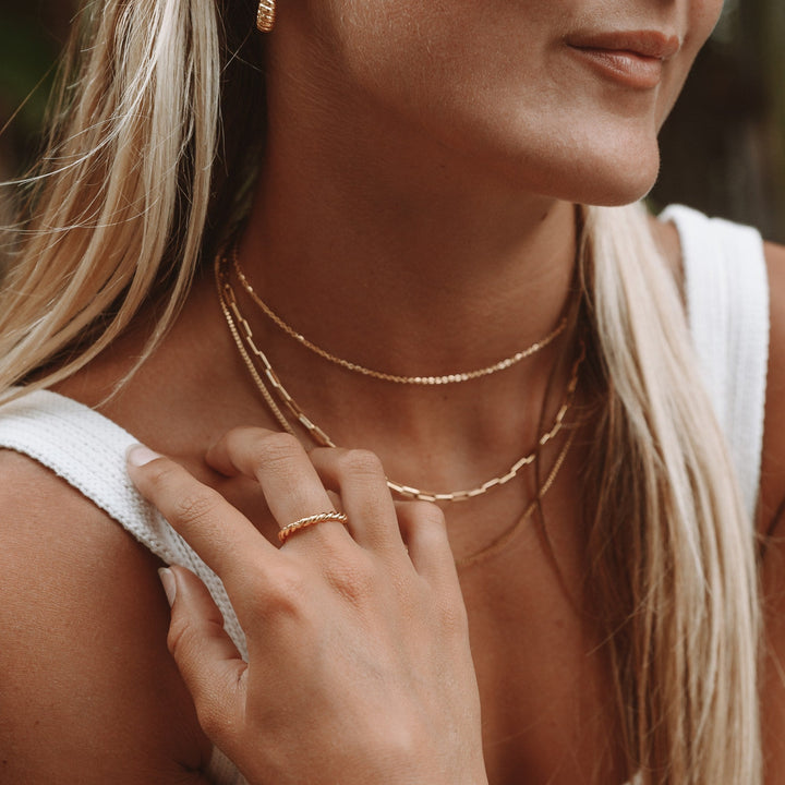 Hypoallergenic women's gold or silver twisted ring, an elegant and symbolic piece of connection jewelry.