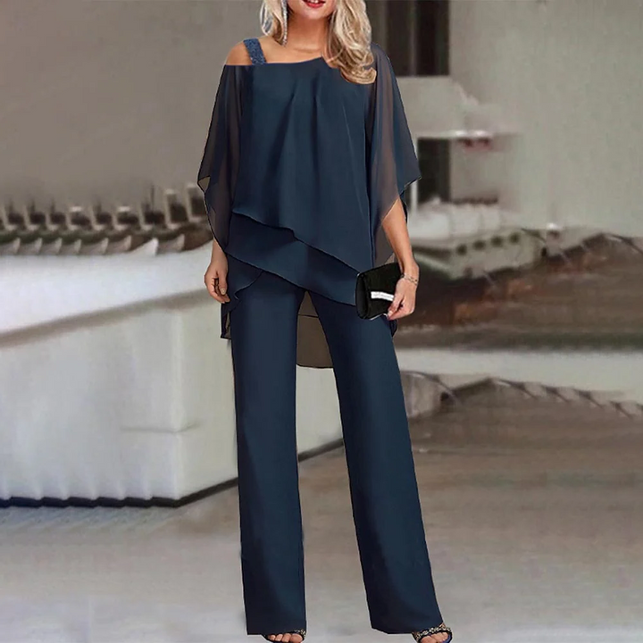 Modern women's elegant two-piece set featuring a cold shoulder top & long pants, ideal for stylish formal wear.