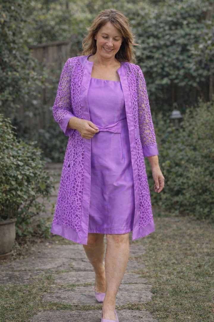 Stylish women's elegant two-piece set featuring a dress and coordinating jacket for sophisticated look.