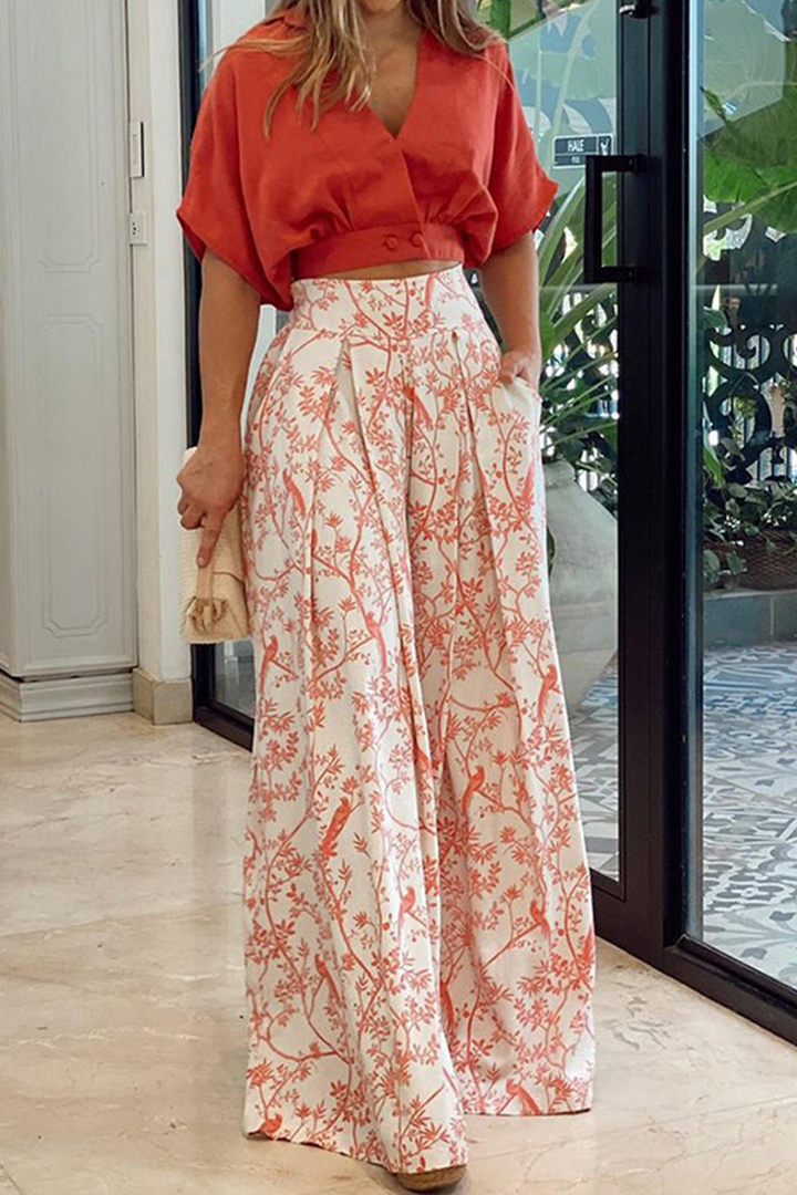 Women's elegant crop top and flowing high-waist floral maxi skirt set for a chic, comfortable look.