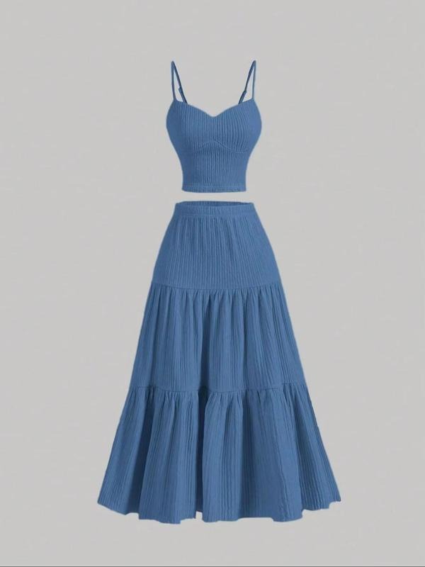 Comfortable women's coordinated midi skirt set with camisole, versatile for summer fashion.