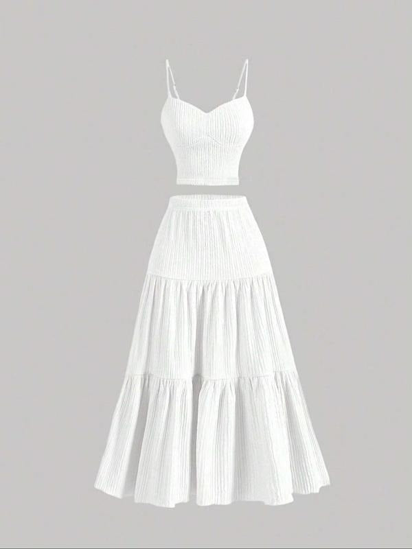 Stylish women's camisole and midi skirt two-piece set, an elegant choice for summer fashion.