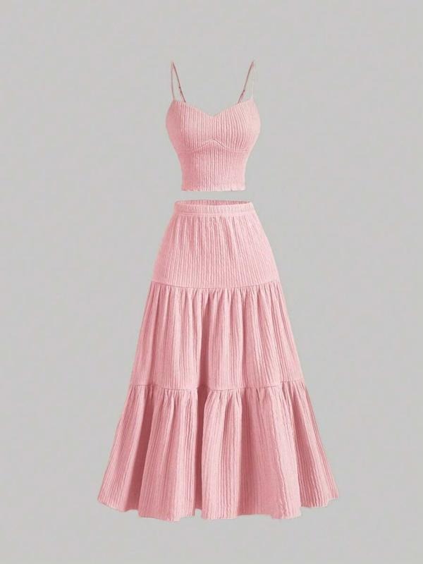 Coordinated women's two-piece set featuring a stylish camisole and a flowy midi skirt.
