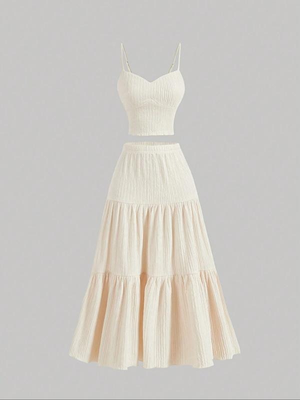 Women's elegant midi skirt and camisole two-piece set, ideal for versatile summer fashion.