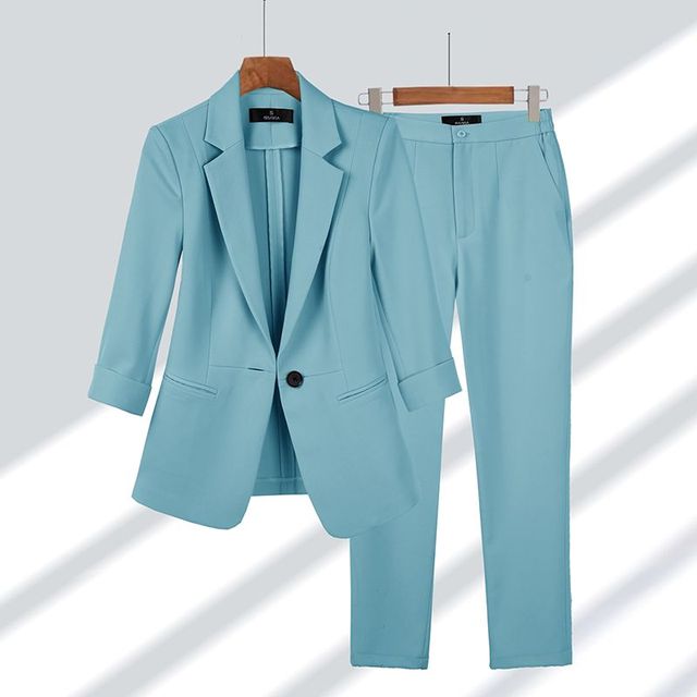 Ladies' fashion two-piece set: a modern blazer and elegant trousers for a professional or casual chic outfit.
