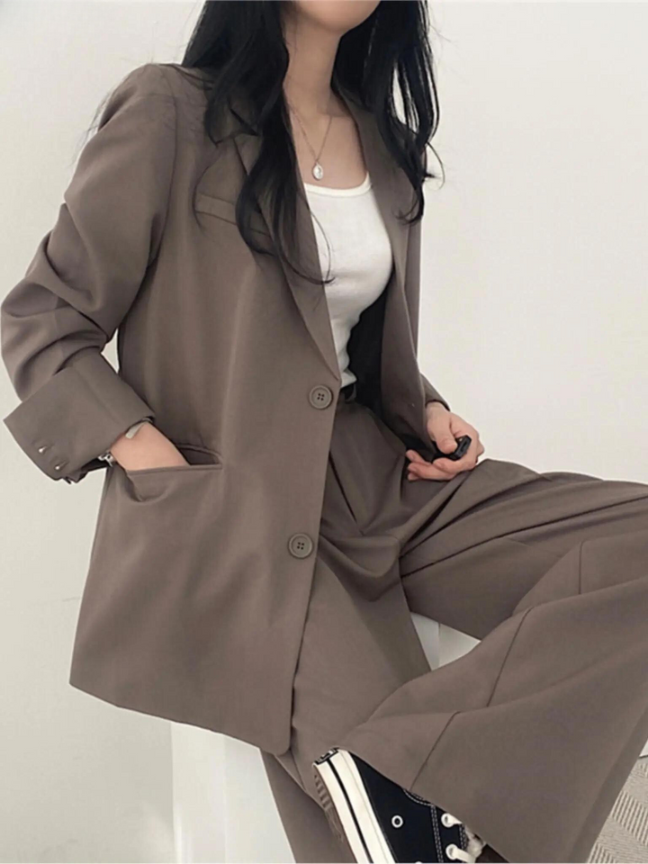 Modern women's two-piece suit. Comfortable & versatile formal attire for professional business meetings.