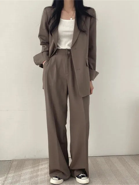 Stylish two-piece women's suit set. Elegant attire for office, formal events, and versatile fashion.