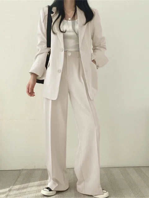 Sophisticated women's elegant suit set. Versatile jacket & trousers for formal events & daily fashion.