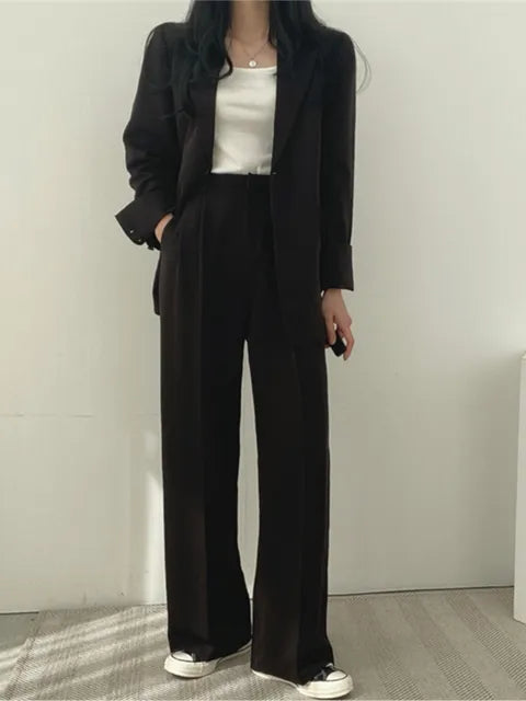 Stylish women's two-piece suit. Professional attire for office, business casual, and formal events.
