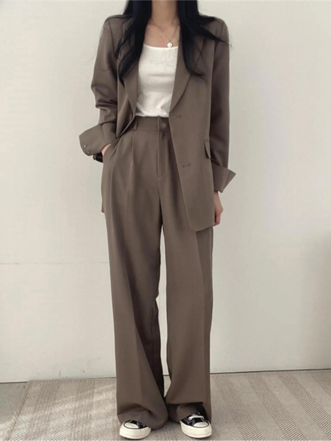 Women's formal two-piece suit. Stylish business casual outfit for professional office and events.