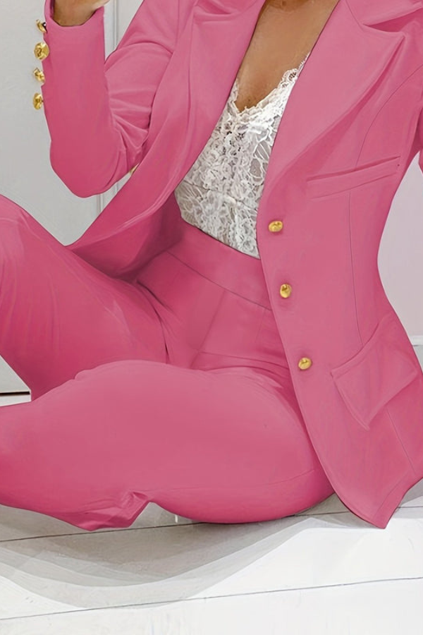 Modern two-piece women's suit with a chic blazer and elegant pants, perfect for work.