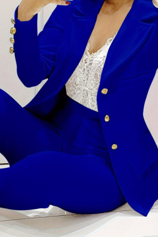 Business women's coordinated suit: tailored blazer and matching professional pants.