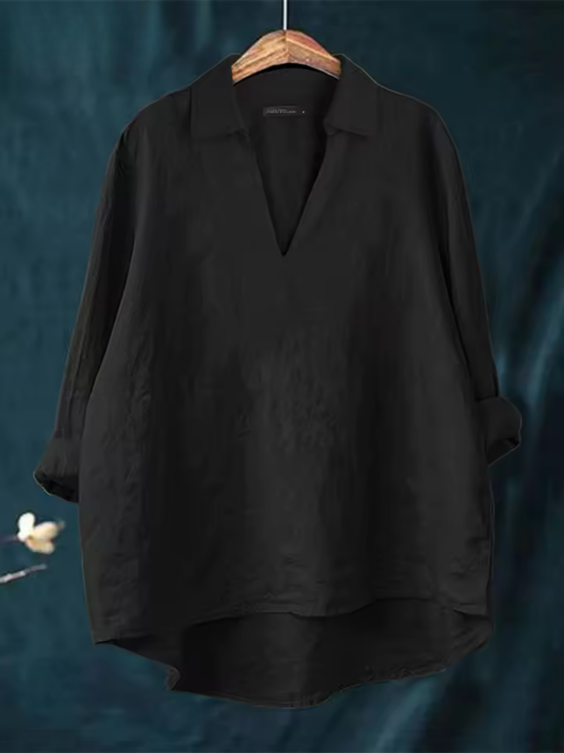Versatile women's V-neck blouse. Comfortable, chic top suitable for casual outings or office wear.