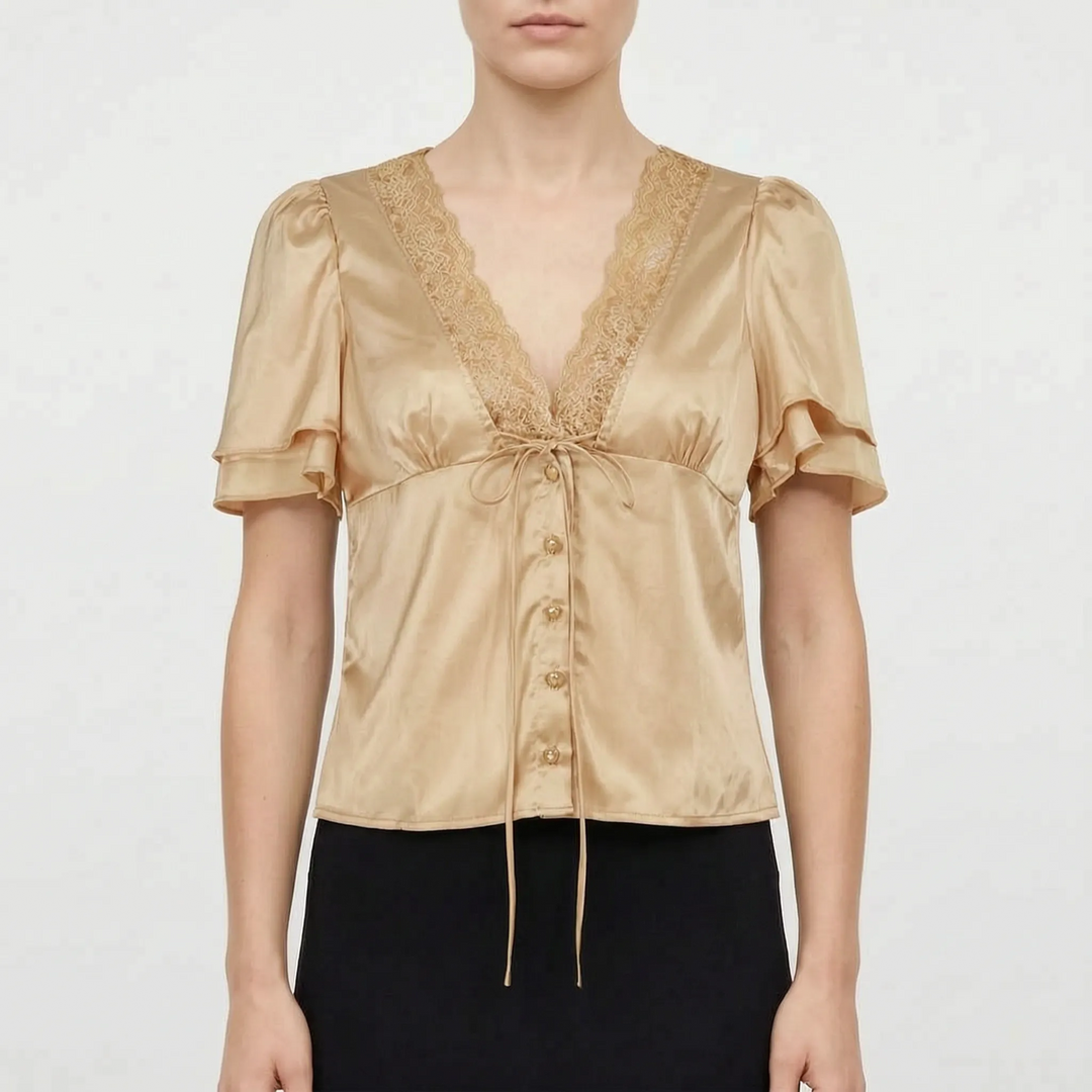 Women's elegant V-neck blouse with delicate lace detail & comfortable flutter sleeves. Perfect for casual-chic summer style.
