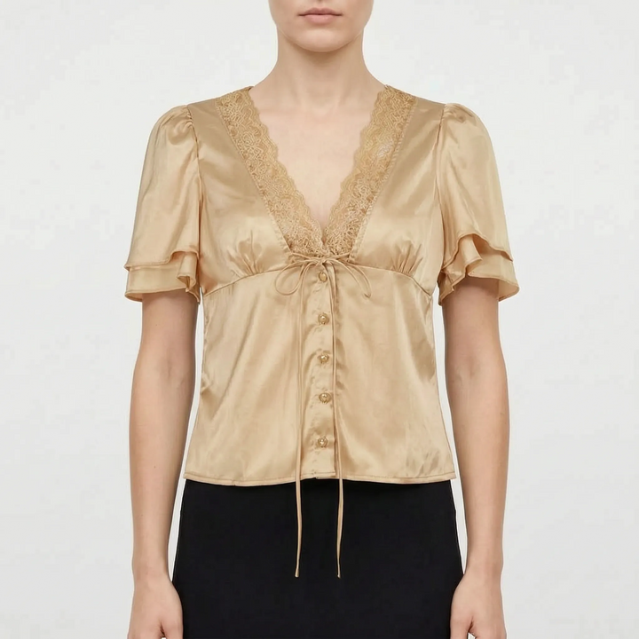 Women's elegant V-neck blouse with delicate lace detail & comfortable flutter sleeves. Perfect for casual-chic summer style.