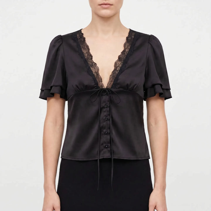 Sophisticated women's lace-trim V-neck top with short sleeves. A chic and versatile blouse ideal for any day to night look.