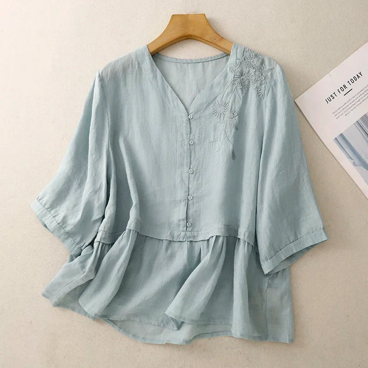 Elegant women's V-neck button-front blouse in a stylish, versatile design, perfect for work or casual wear.