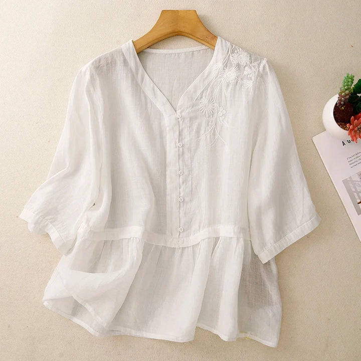 Chic women's V-neck blouse, elegant and button-front, a versatile top for spring fashion and summer casual wear.