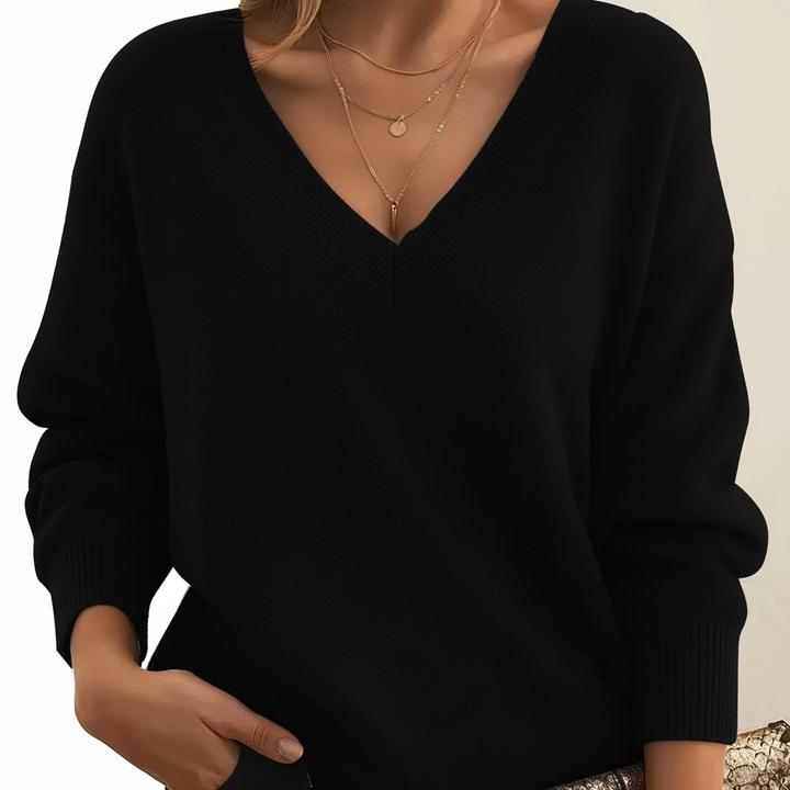 Stylish women's V-neck sweater in gray, versatile cashmere blend for elegant autumn outfits