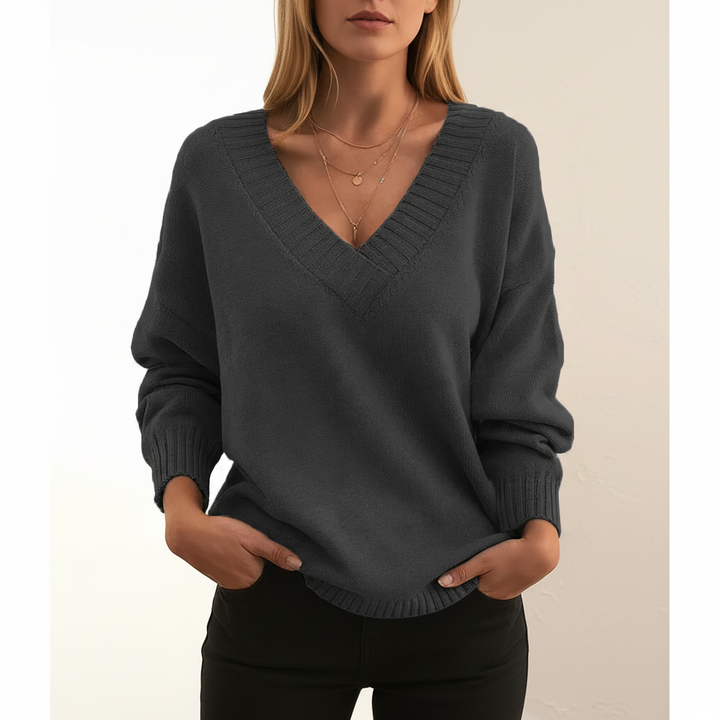 Model wearing a comfortable women's V-neck cashmere blend pullover, ready for winter