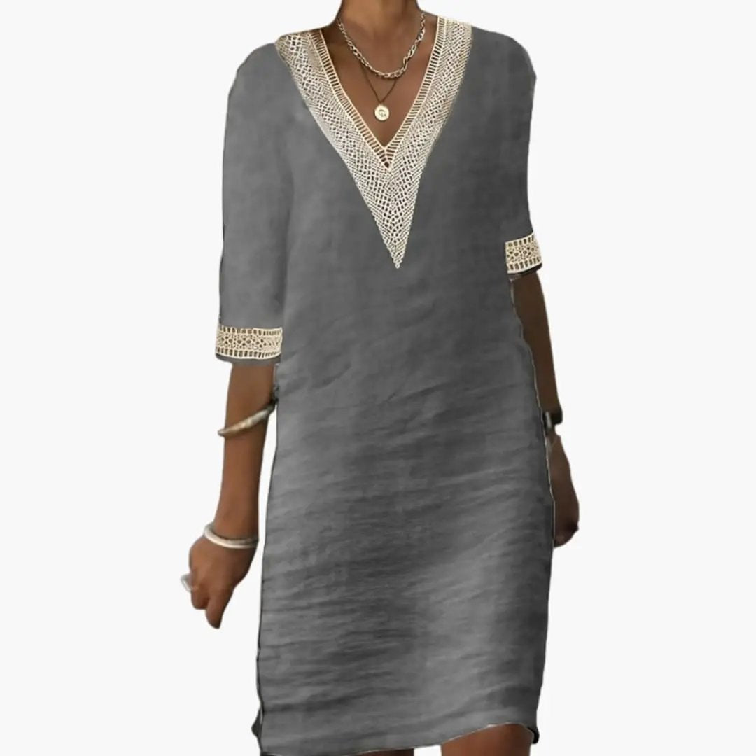 Chic women's V neck midi shift dress for summer vacation. Comfortable relaxed fit, elegant for day wear.