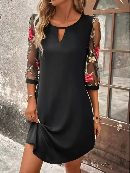 Elegant women's V-neck dress with delicate sheer sleeves and a vibrant floral print, perfect for parties.
