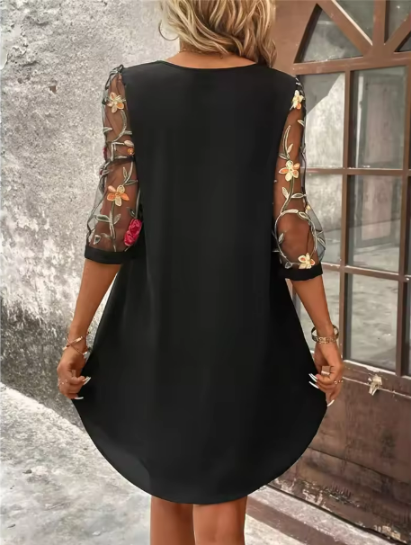 Stylish women's floral print V-neck dress, featuring sheer sleeves, ideal for elegant or special occasions.