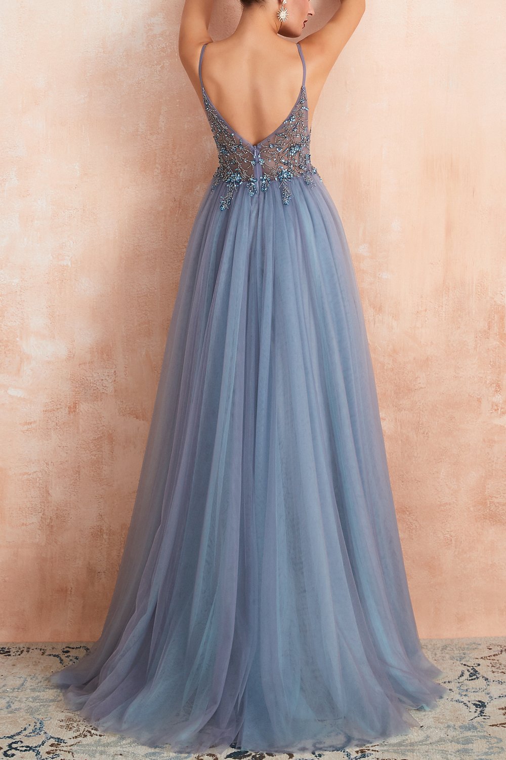 Stylish long tulle formal gown with V-neck and daring split for women's special occasions.