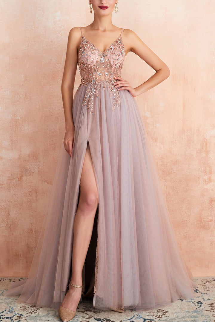 Chic pink women's V-neck evening gown featuring an elegant split for memorable occasions.