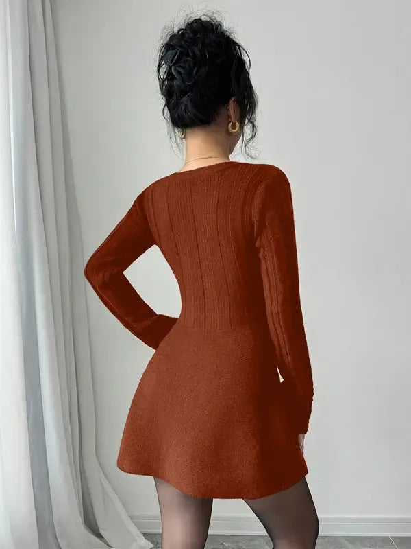 Chic women's V-neck flared mini dress with long sleeves, offering an elegant and sophisticated look.