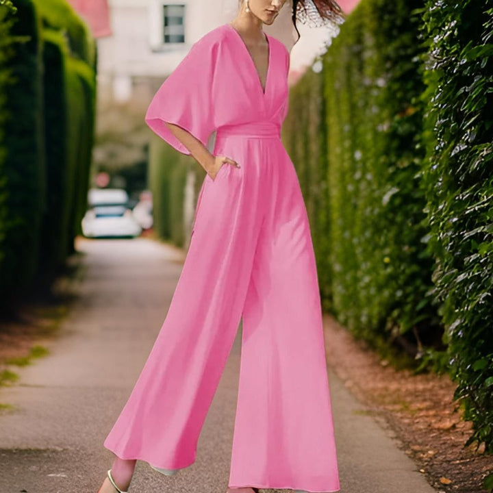 Fashionable women's V-neck jumpsuit with three-quarter sleeves. Elegant and comfortable womens apparel.