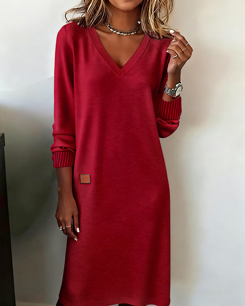 Comfortable long sleeve V-neck midi dress for women, a flattering work dress for office professionals.