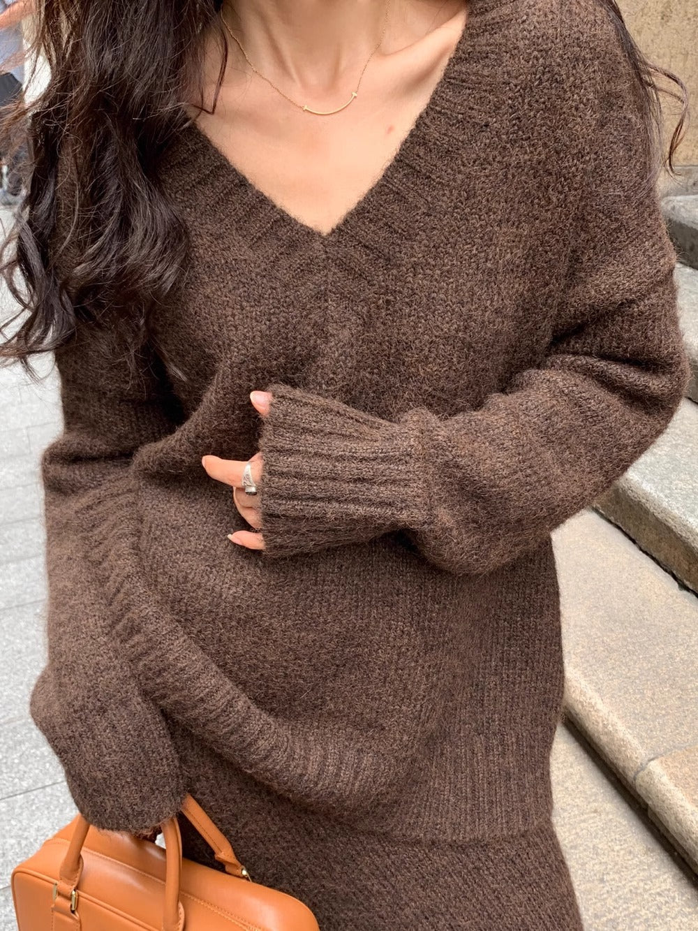 Comfortable women's knit sweater & midi skirt set. Stylish V-neck long sleeve top and elegant two-piece outfit.