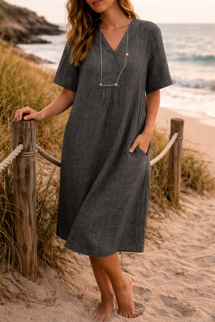 Women's comfortable V-neck short-sleeve midi dress. Loose fit and flowy, perfect for warm summer days.