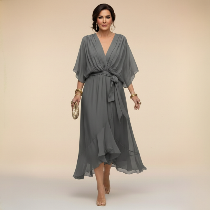 Chic women's V-neck maxi dress with a beautiful flowing silhouette, perfect for elegant evening wear.