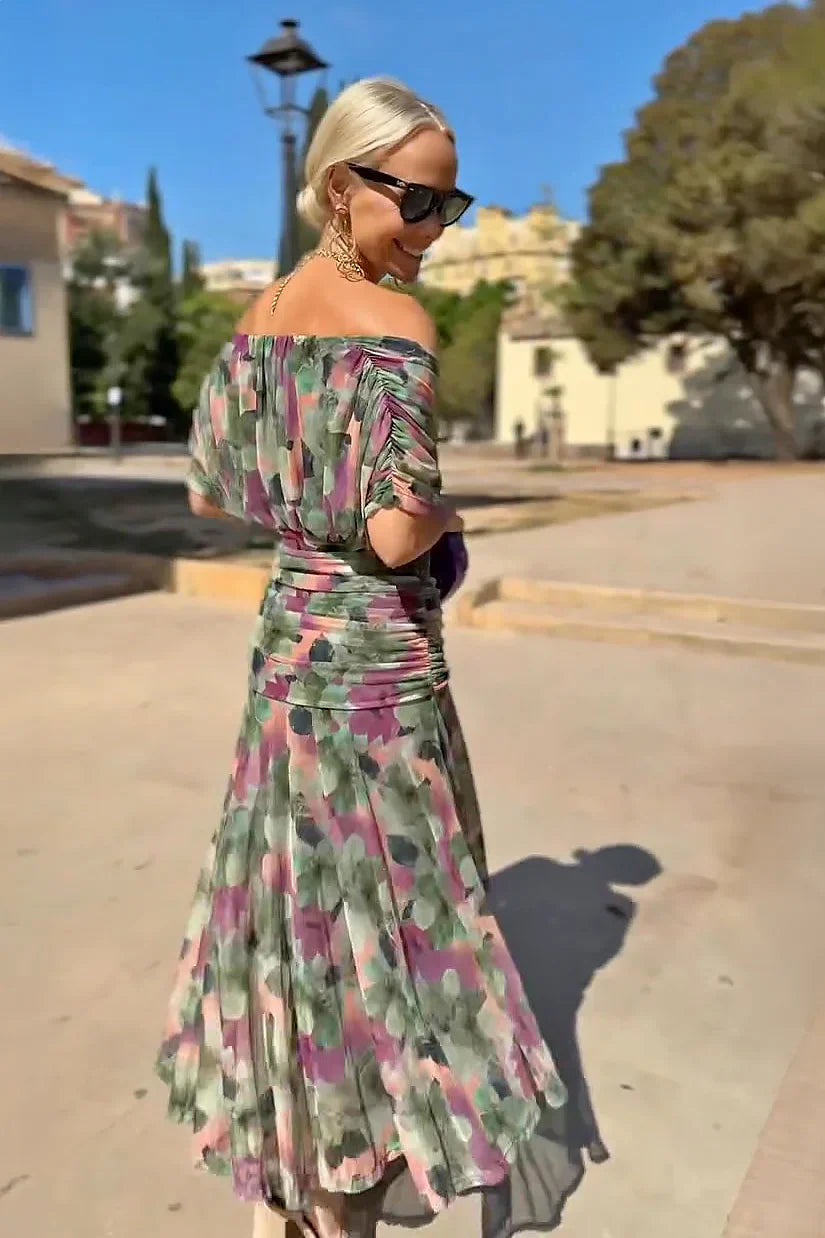 Flowy women's V-neck maxi dress with flutter sleeves, creating an elegant silhouette for any event.